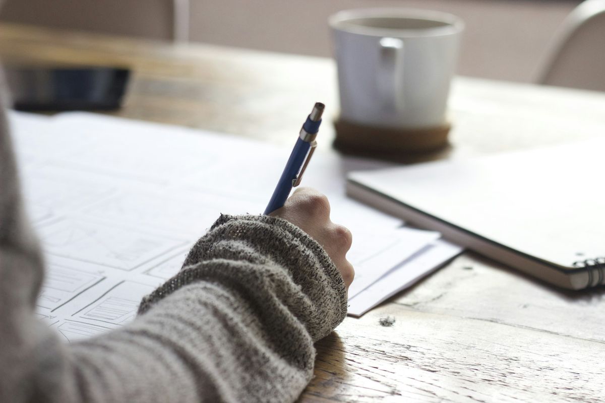A student working through a practice problem by hand
